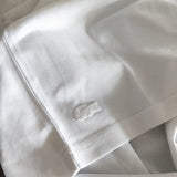 Side profile of Lacoste luxury clothing with tailored silhouette
