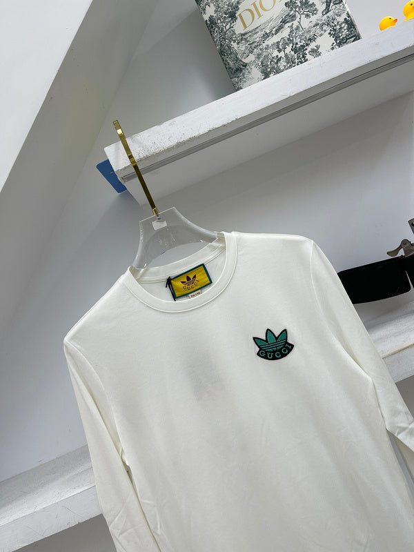 Flat lay presentation of Gucci luxury clothing with logo-detail design