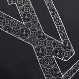 Close-up detail shot of Louis Vuitton luxury clothing with runway-inspired design