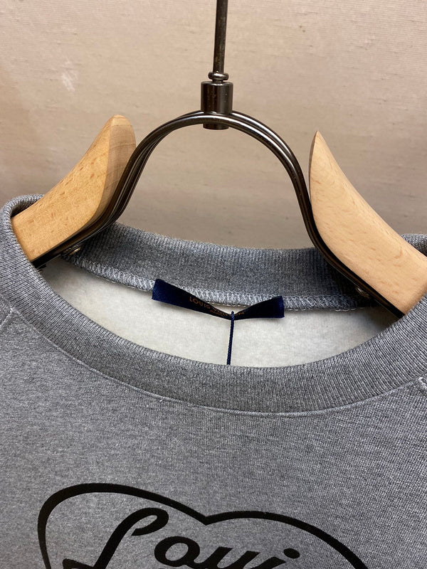 Close-up detail shot of Louis Vuitton cotton t-shirt with signature branding