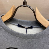 Close-up detail shot of Louis Vuitton cotton t-shirt with signature branding