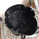 Side profile of refined everyday-luxe women's handbag – women's luxury accessory