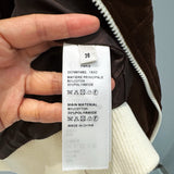 Celine Bomber Jacket flat lay on neutral background