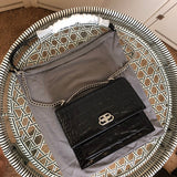 Back view of chic polished women's handbag – women's everyday handbag