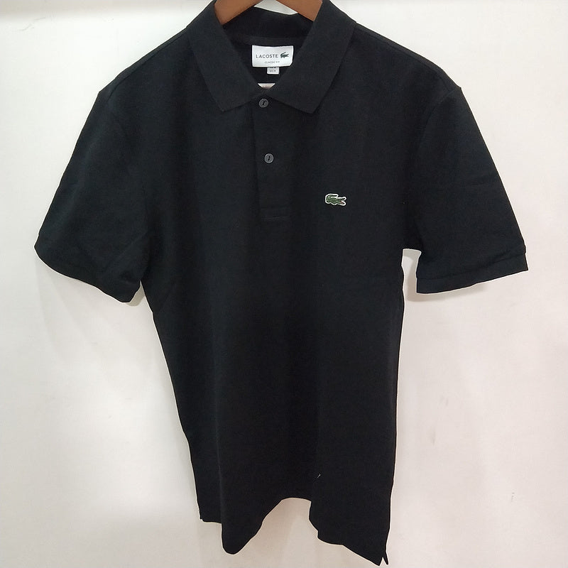 Flat lay presentation of Lacoste luxury clothing with monogram-inspired silhouette
