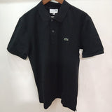 Flat lay presentation of Lacoste luxury clothing with monogram-inspired silhouette