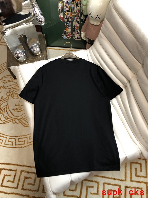 Flat lay presentation of Moncler luxury clothing with monogram-inspired silhouette