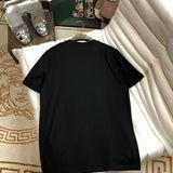 Flat lay presentation of Moncler luxury clothing with monogram-inspired silhouette
