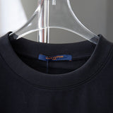 Close-up detail shot of Louis Vuitton cotton t-shirt with monogram-inspired silhouette