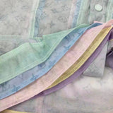 Side profile of Louis Vuitton luxury clothing with signature branding