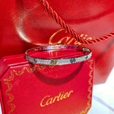 Side view of Cartier unisex jewelry piece