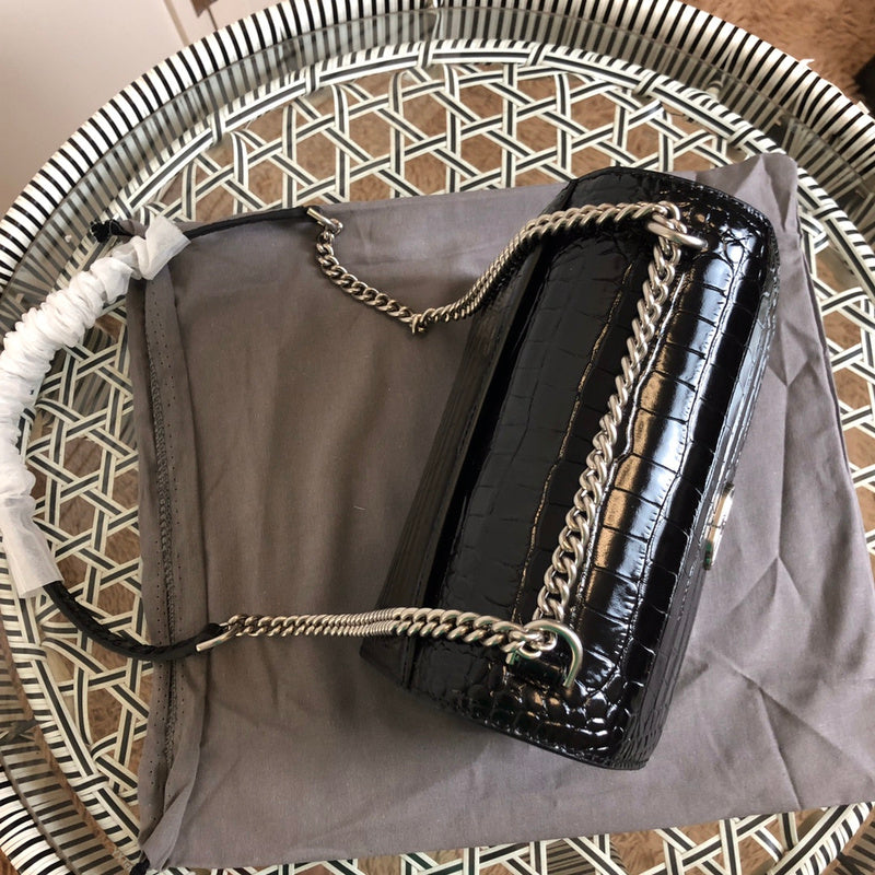 Handle and strap detail of chic polished women's handbag – women's everyday handbag
