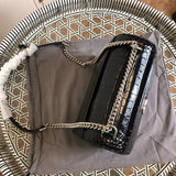 Handle and strap detail of chic polished women's handbag – women's everyday handbag