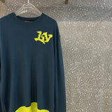 Front view of Louis Vuitton luxury clothing with label-forward styling