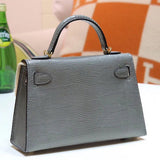 Side view of clean-lined structured handbag