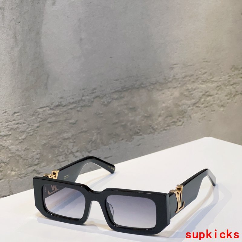 Close-up detail view of Louis Vuitton unisex sunglasses