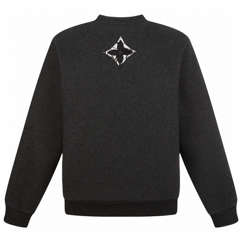 Side profile of Louis Vuitton luxury clothing with signature branding