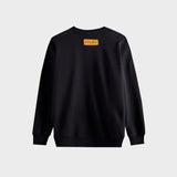 Side profile of Louis Vuitton luxury clothing with label-forward styling