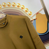 Full styled look of Louis Vuitton luxury clothing with monogram-inspired silhouette