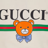 Flat lay presentation of Gucci luxury clothing with everyday silhouette