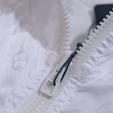 Front view of Louis Vuitton luxury clothing with label-forward styling