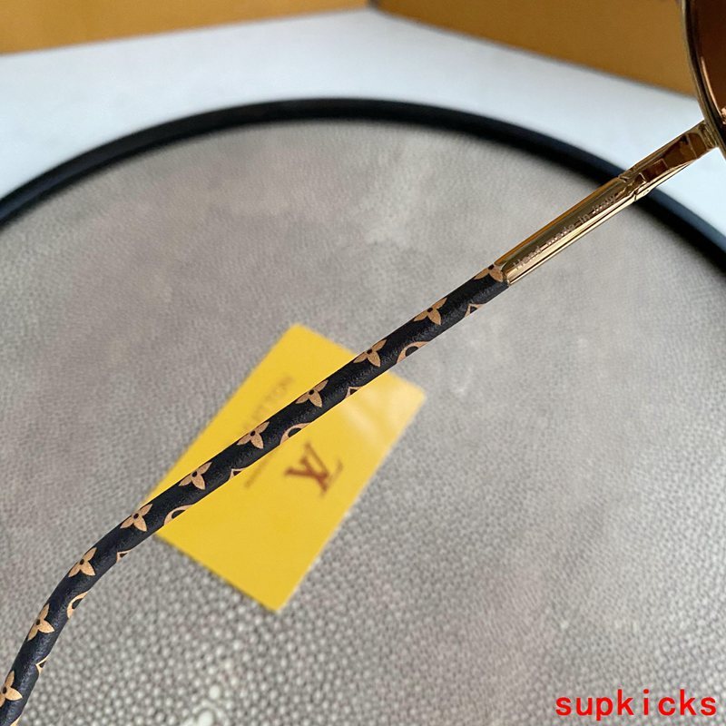 Close-up detail view of Louis Vuitton unisex sunglasses