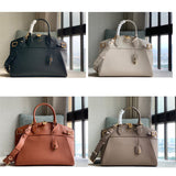  graceful top-handle bag styled with outfit