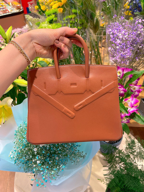 Side view of minimalist structured handbag