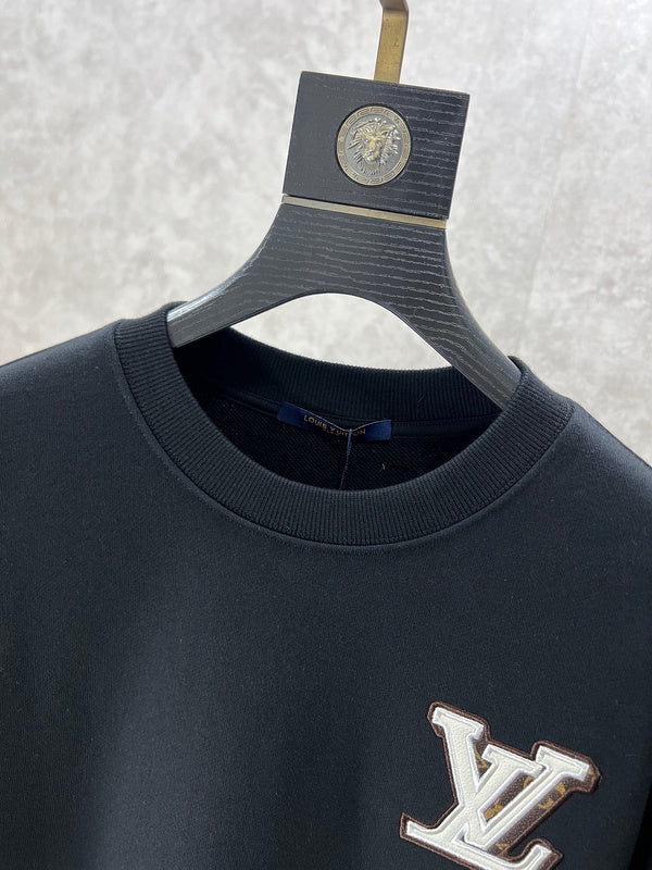 Full styled look of Louis Vuitton luxury clothing with logo-detail design