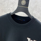 Full styled look of Louis Vuitton luxury clothing with logo-detail design