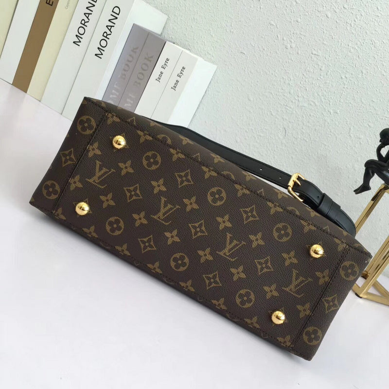Styled lifestyle shot of polished elevated women's handbag – women's luxury accessory