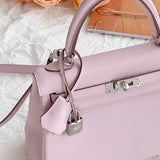  graceful top-handle bag styled with outfit