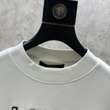 Close-up detail shot of Louis Vuitton luxury clothing with monogram-inspired silhouette