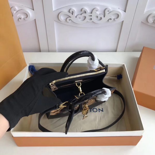 Close-up detail of polished modern women's handbag – women's designer-style accessory