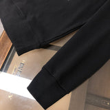 Back view of Louis Vuitton luxury clothing with tailored silhouette