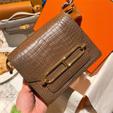  Clean-Lined top-handle bag carried on shoulder