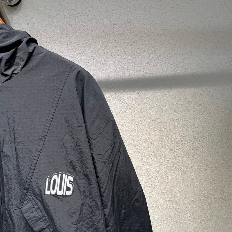 Front view of Louis Vuitton luxury clothing with label-forward styling