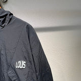 Front view of Louis Vuitton luxury clothing with label-forward styling