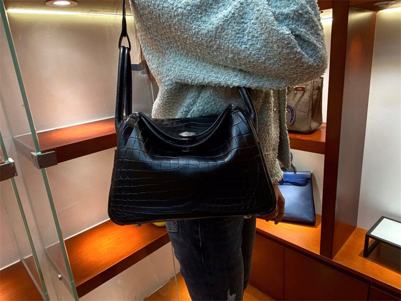  Sleek structured bag carried on shoulder