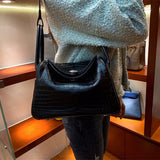  Sleek structured bag carried on shoulder