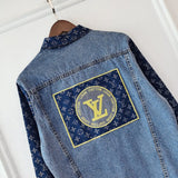Close-up detail shot of Louis Vuitton luxury clothing with logo-detail design