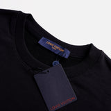 Close-up detail shot of Louis Vuitton luxury clothing with label-forward styling