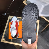 Hermès Red Slip-On Sneakers - Angled View