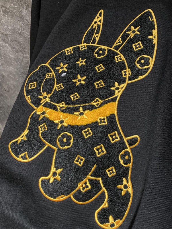 Full styled look of Louis Vuitton luxury clothing with label-forward styling