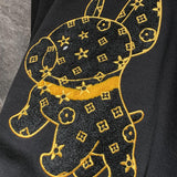 Full styled look of Louis Vuitton luxury clothing with label-forward styling