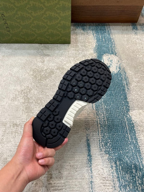 Side profile of Gucci tonal black sneakers premium leather build