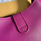Side view of sculpted structured handbag