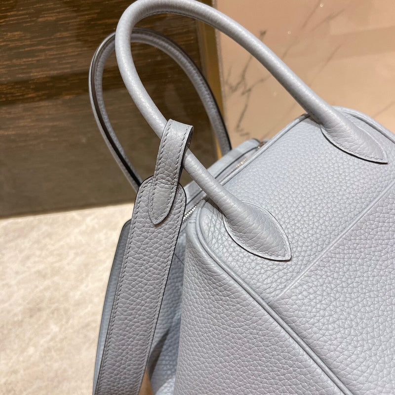 Side view of minimalist structured handbag