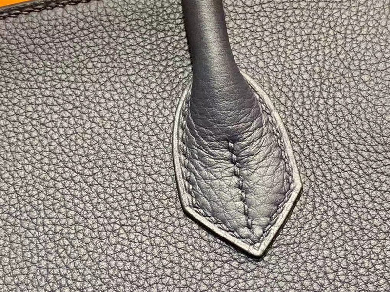 Side view of sleek structured handbag