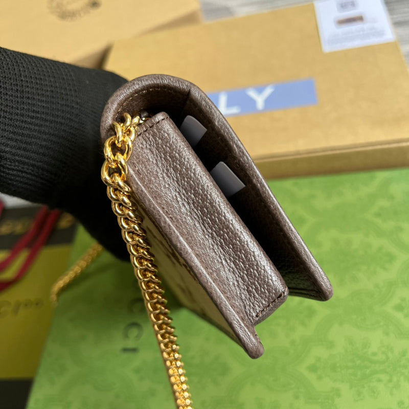 Handle and strap detail of chic polished women's handbag – women's statement bag